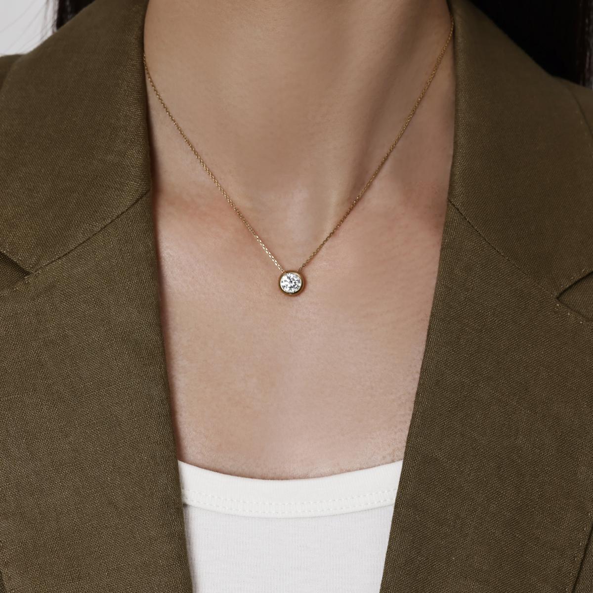 Model wearing a 1.0ct Bezel Round Diamond Necklace 16–18" Chain Length (adjustable)