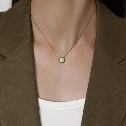 Model wearing a 1.0ct Bezel Round Diamond Necklace 16–18" Chain Length (adjustable)