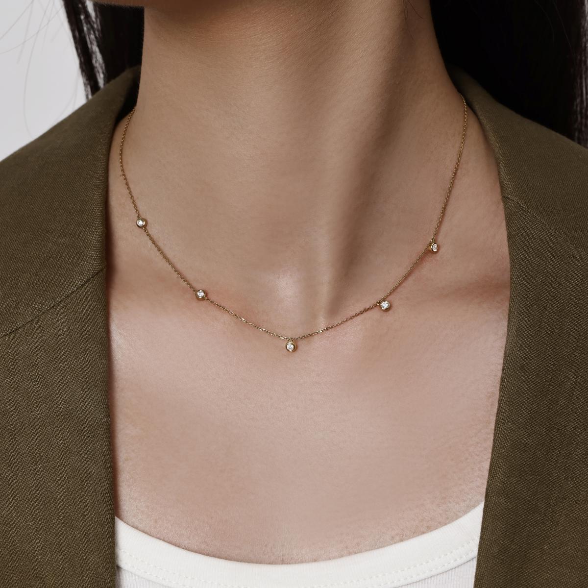 Model wearing a 5 bezel-set round cut Diamonds Station Necklace