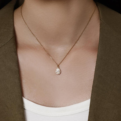 Model wearing a Halo Pear Cut Diamond Pendant Necklace 7.5×12.6mm Pendant dimensions