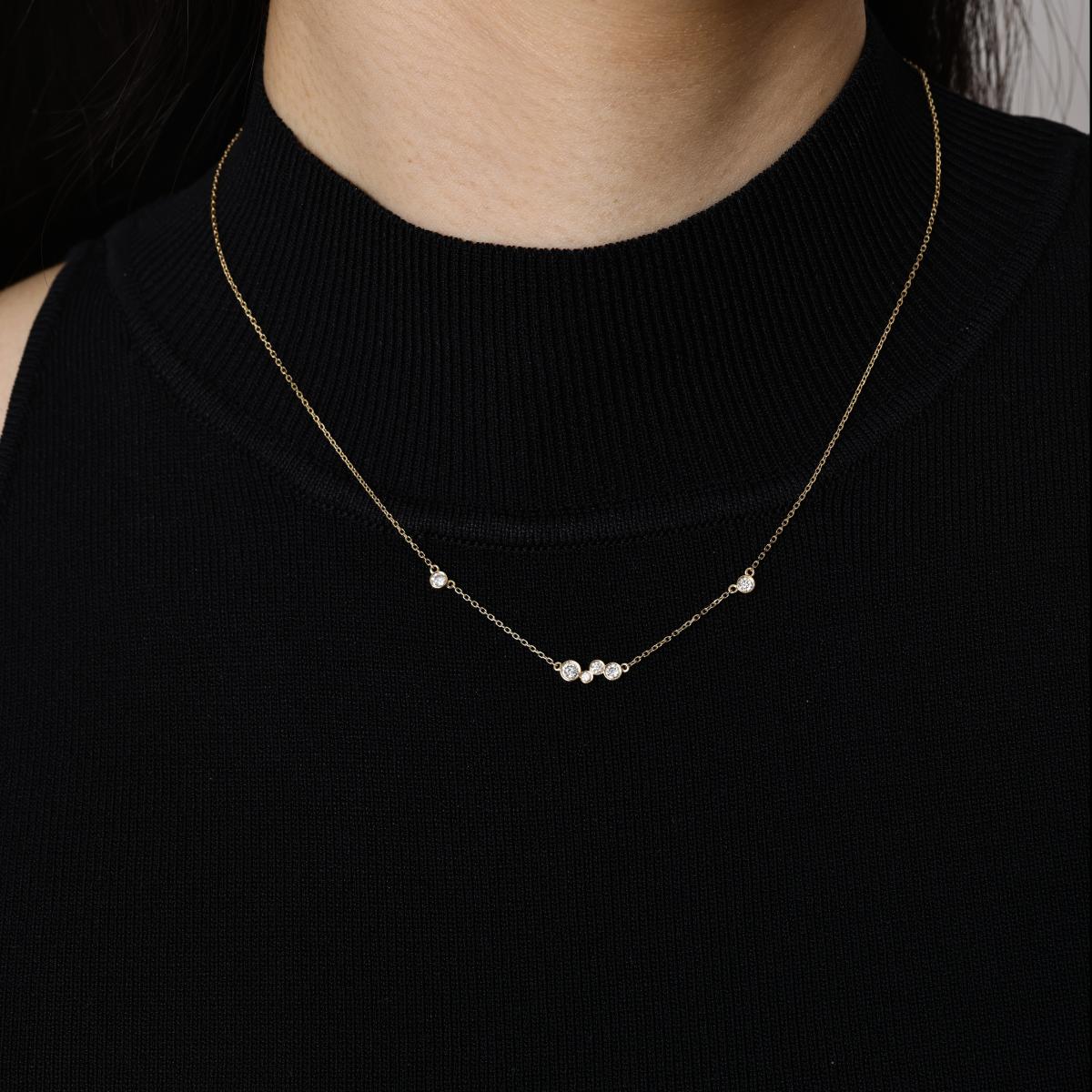 Model wearing a Mixed 6 Bezel set Round Diamonds Necklace 16–18" Chain Length (adjustable)