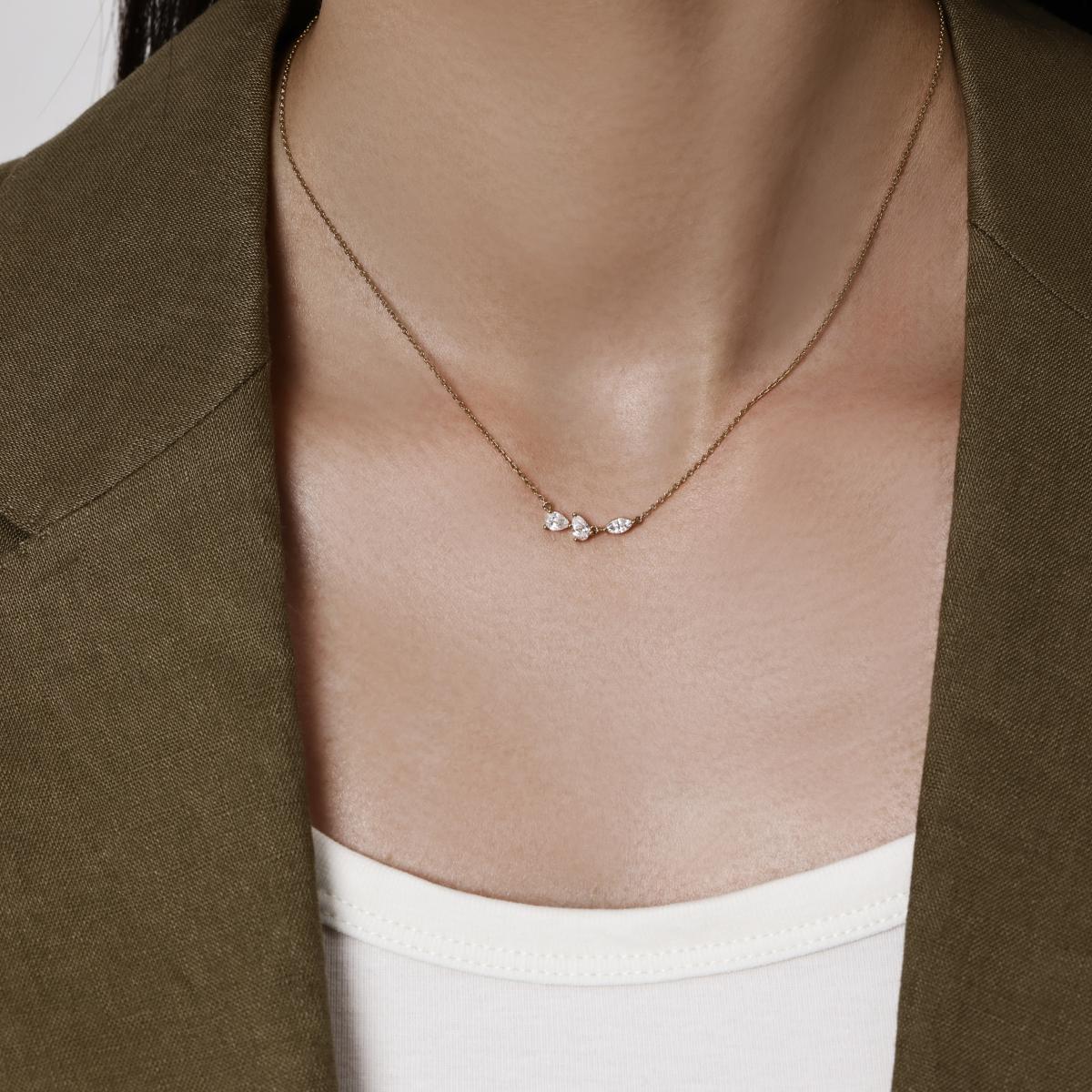 Model wearing a Trio of Pear & Marquise Cut Diamond Necklace 2 pear diamonds 4.5 × 2.8 mm each, 1 marquise diamond 5 × 2.6 mm