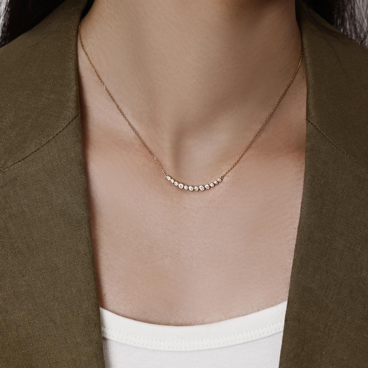 Model wearing a curve of bezel-set Graduated round diamonds Necklace 1.34" Diamond Segment (34mm)