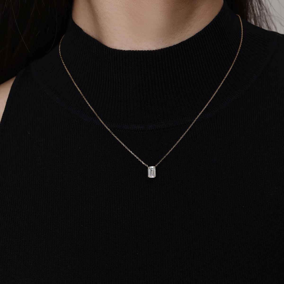 Model wearing an Emerald Cut Diamond Necklace 4.7×6.9mm Pendant dimensions