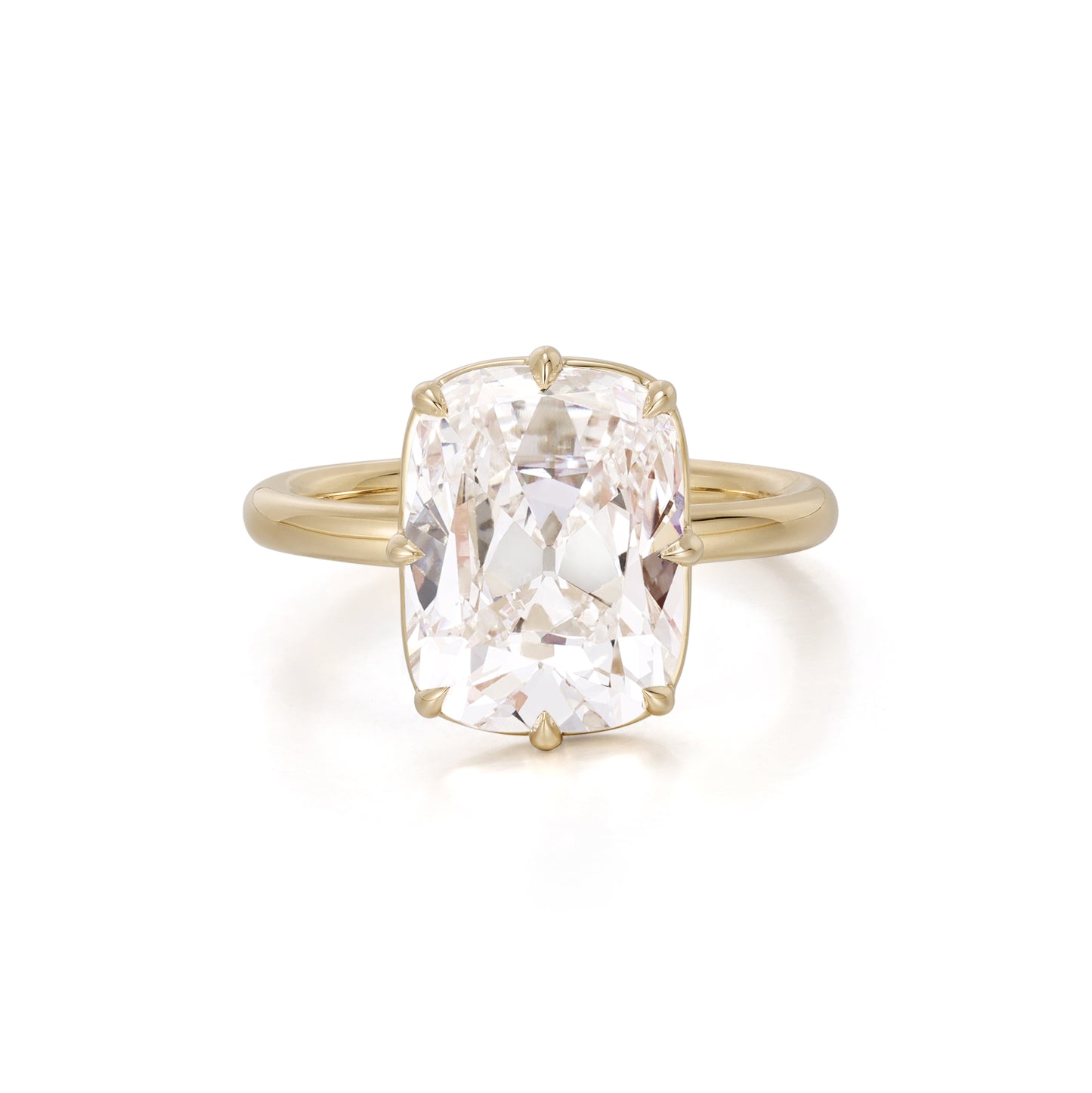 Old mine cushion cut lab grown diamond engagement ring set in 18K yellow gold bezel and prong setting