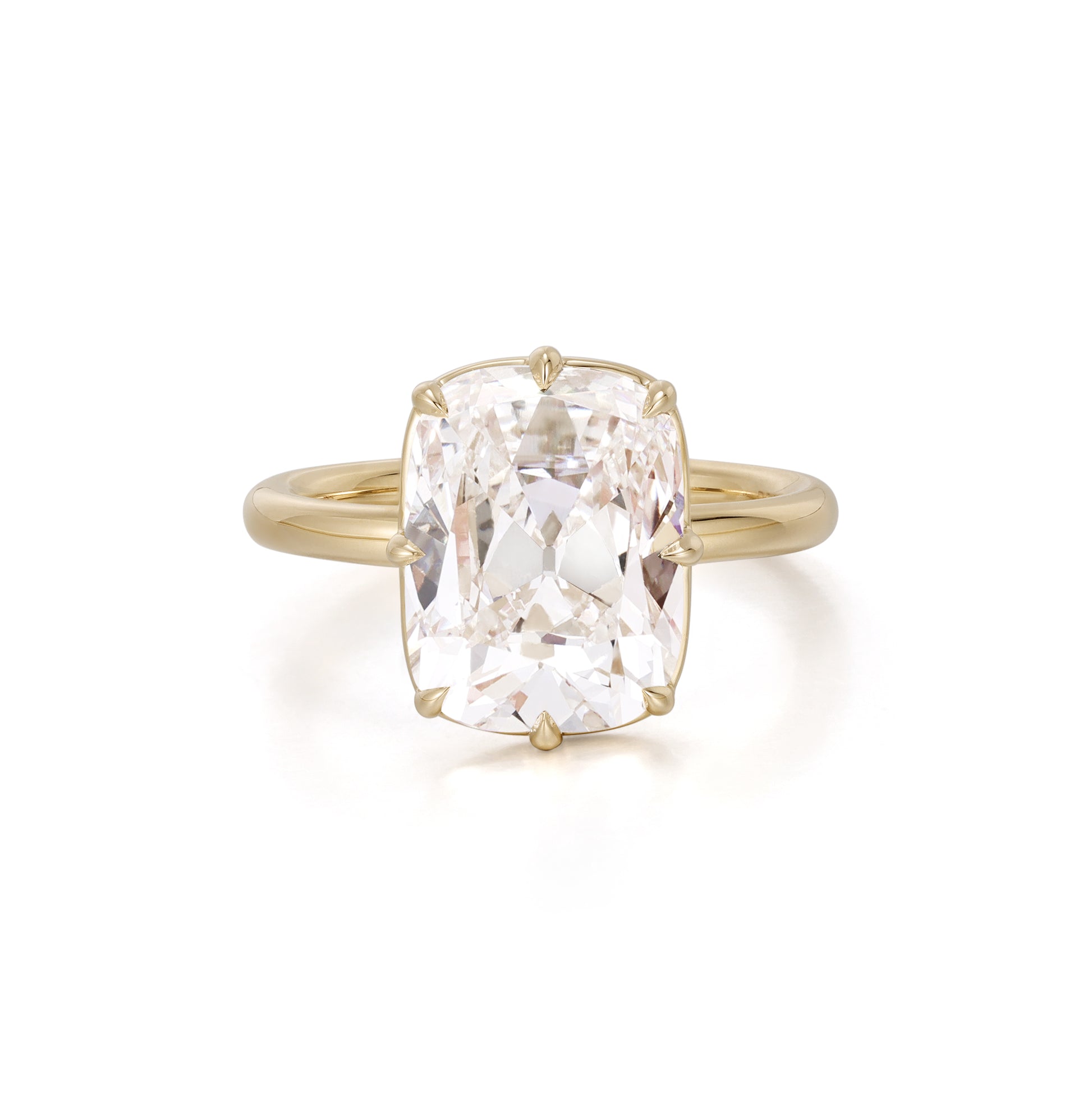 Old mine cushion cut lab grown diamond engagement ring set in 18K yellow gold bezel and prong setting