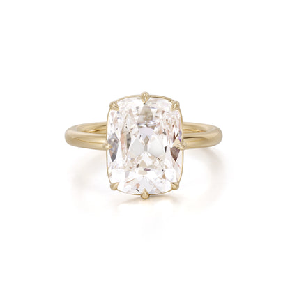 Old mine cushion cut lab grown diamond engagement ring set in 18K yellow gold bezel and prong setting
