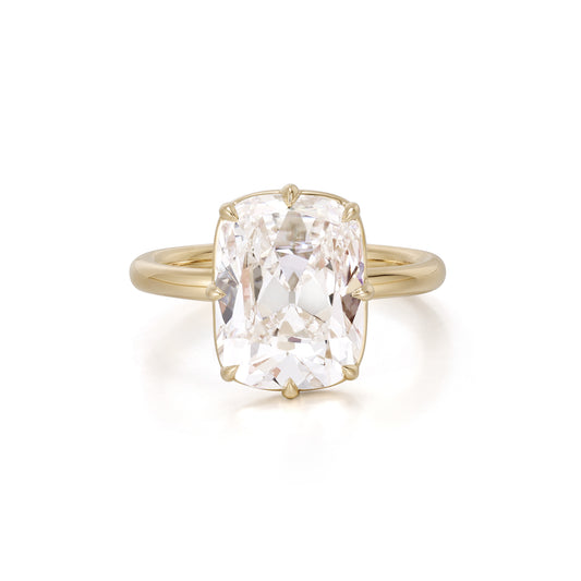 Old mine cushion cut lab grown diamond engagement ring set in 18K yellow gold bezel and prong setting