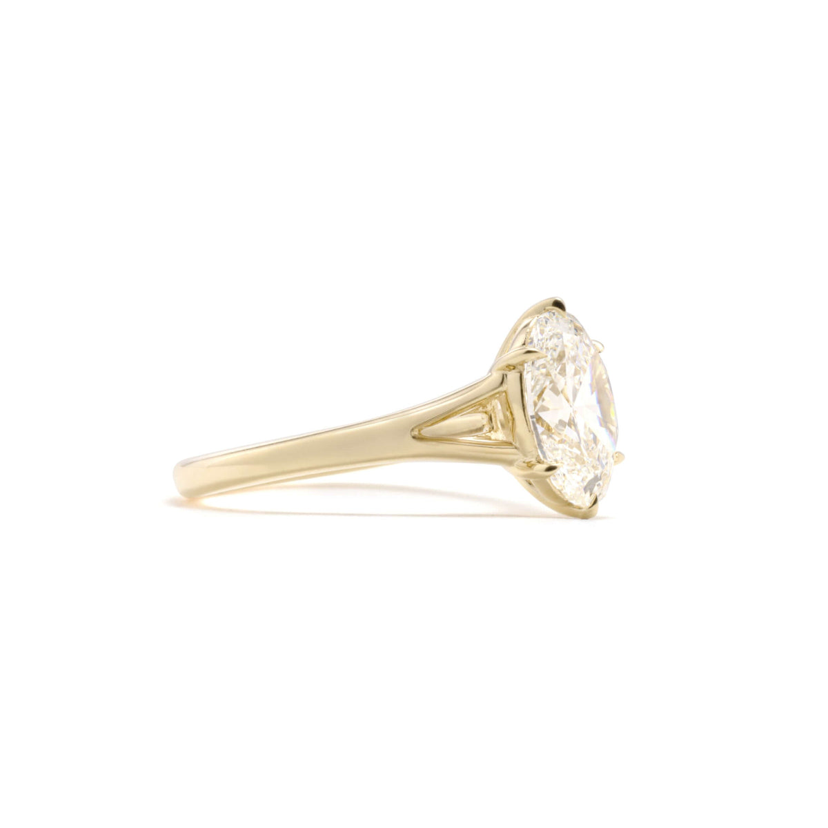 Side-angle showing elegant six-prong setting of Edith oval diamond ring