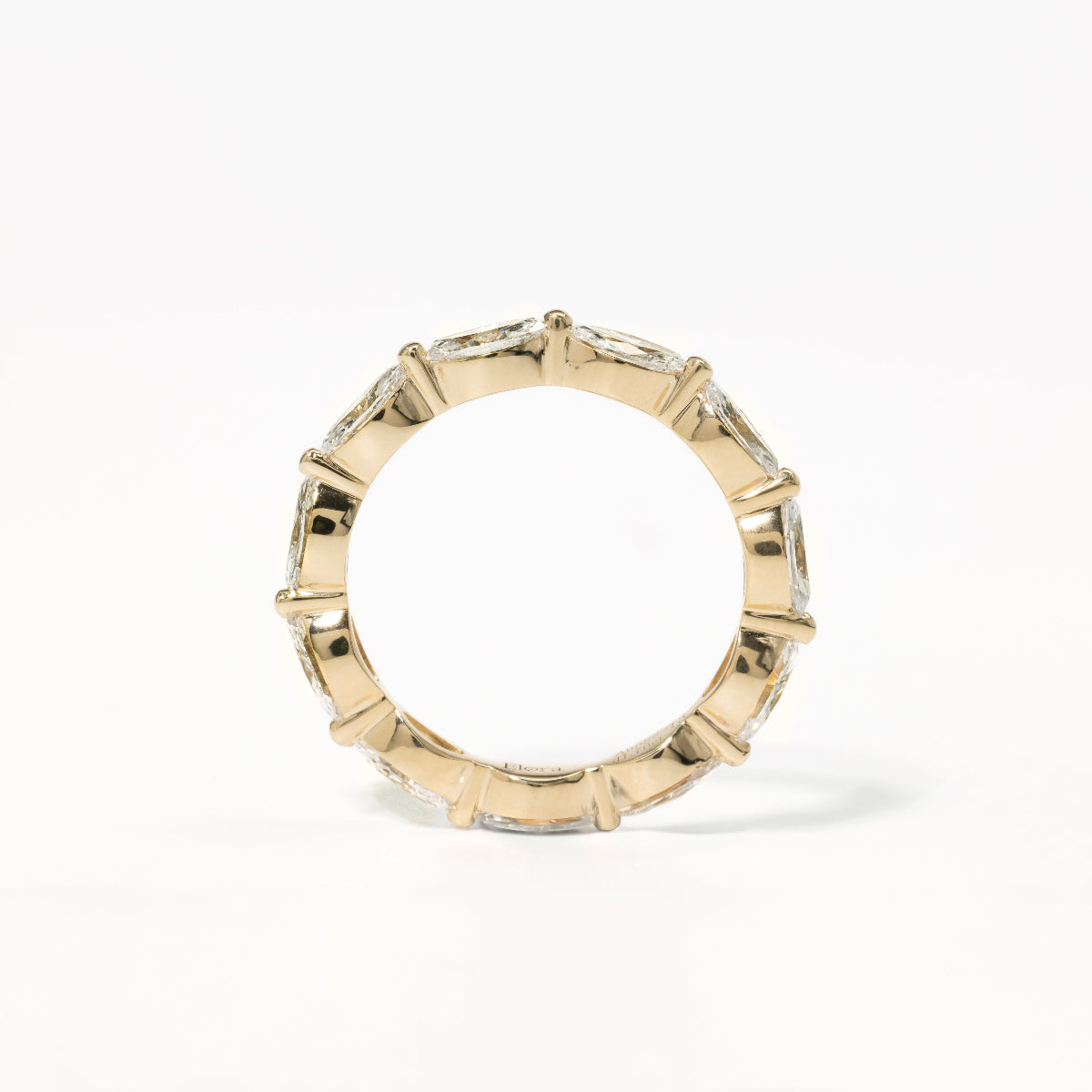 Side angle showing the elongated marquise shape and symmetry of the Maeve eternity band