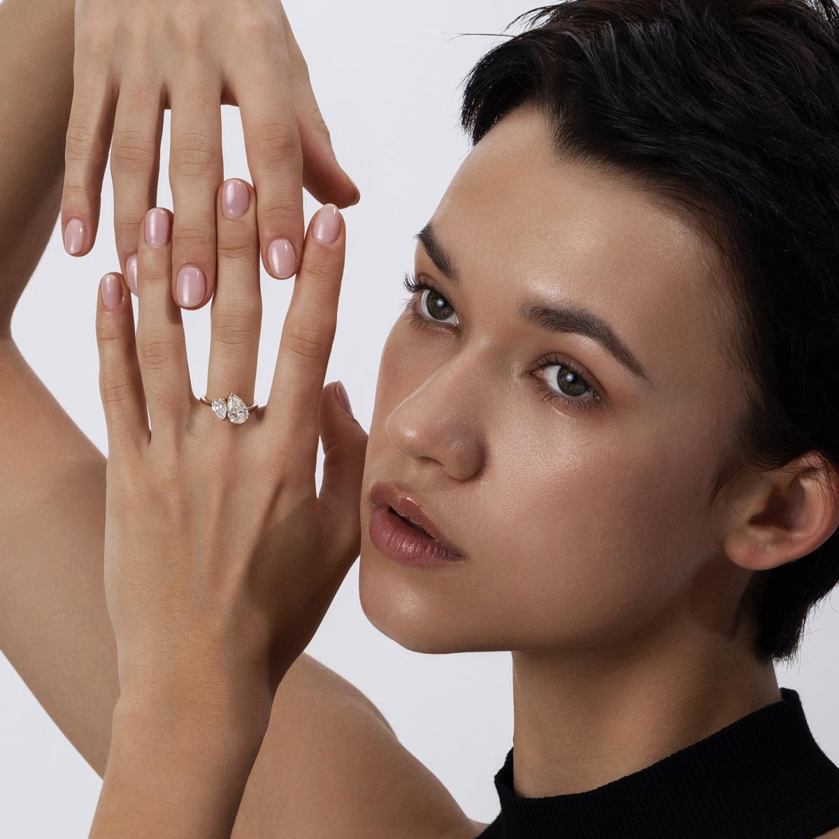 Side hand view of model wearing 2.6ct Pear Cut Diamond Ring