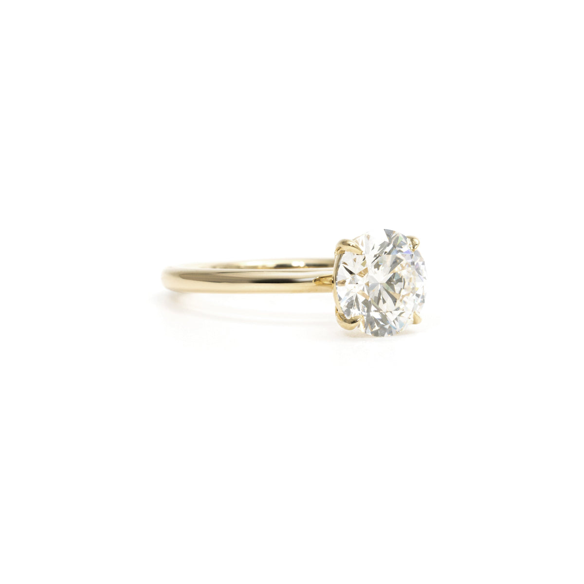Side profile of Chloe round ring showing band thickness and diamond height