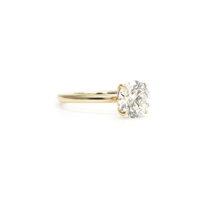 Side profile of Chloe round ring showing band thickness and diamond height