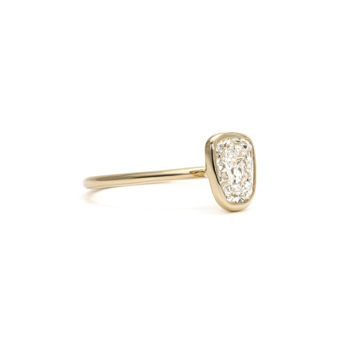 Side profile of Emma ring showcasing Old European cut diamond in four-prong setting