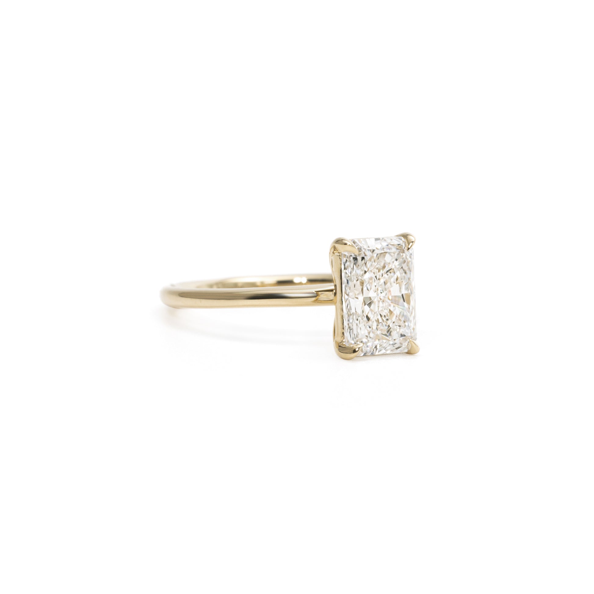 Side profile of Radiant Cut Lab Grown Diamond Ring in four-prong setting