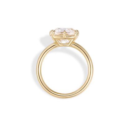 Side profile of old mine cushion cut lab grown diamond engagement ring in 18K yellow gold with bezel and prong setting