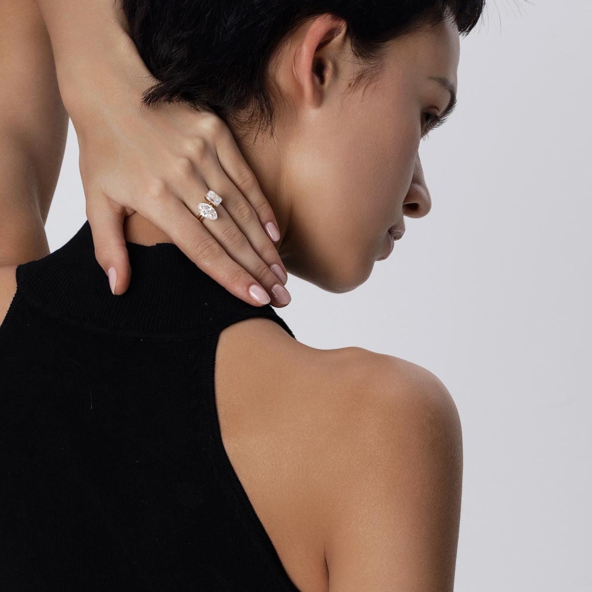 Stacked look featuring Radiant Cut diamond ring paired with a marquise-shaped solitaire