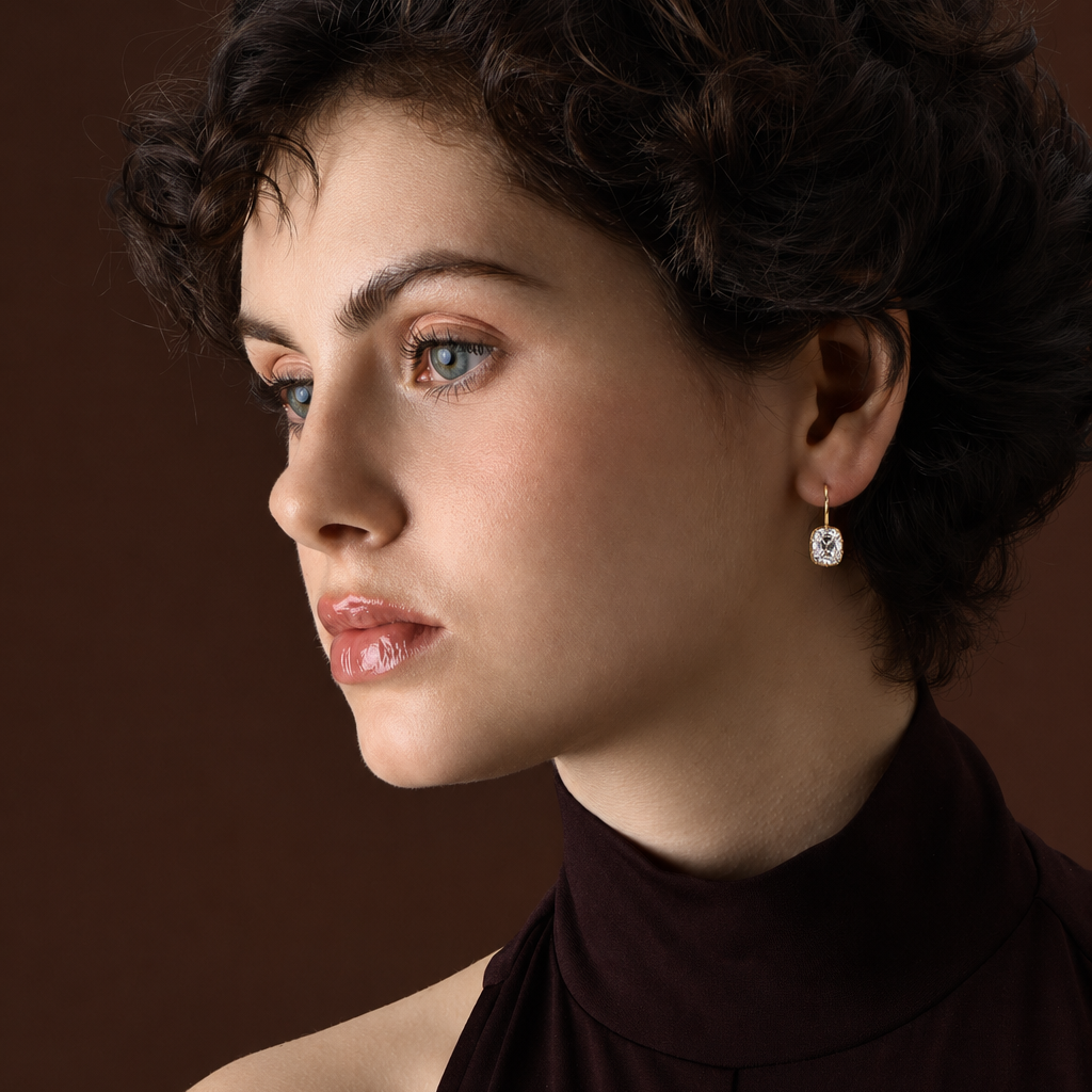Old Mine Cushion Cut Diamond Drop Earrings with Prongs worn by a model against a dark background.