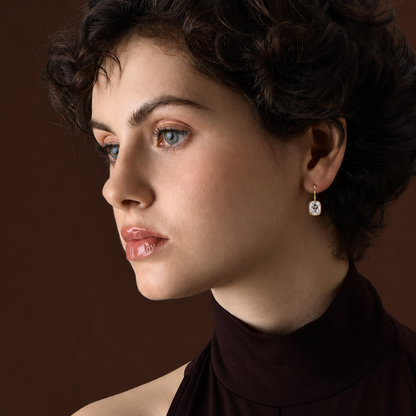 Old Mine Cushion Cut Diamond Drop Earrings with Prongs worn by a model against a dark background.