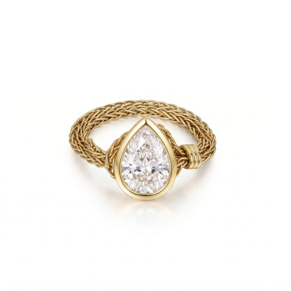 Faith-Pear Cut Lab Grown Diamond Engagement Ring with a pear cut diamond in a woven gold band.
