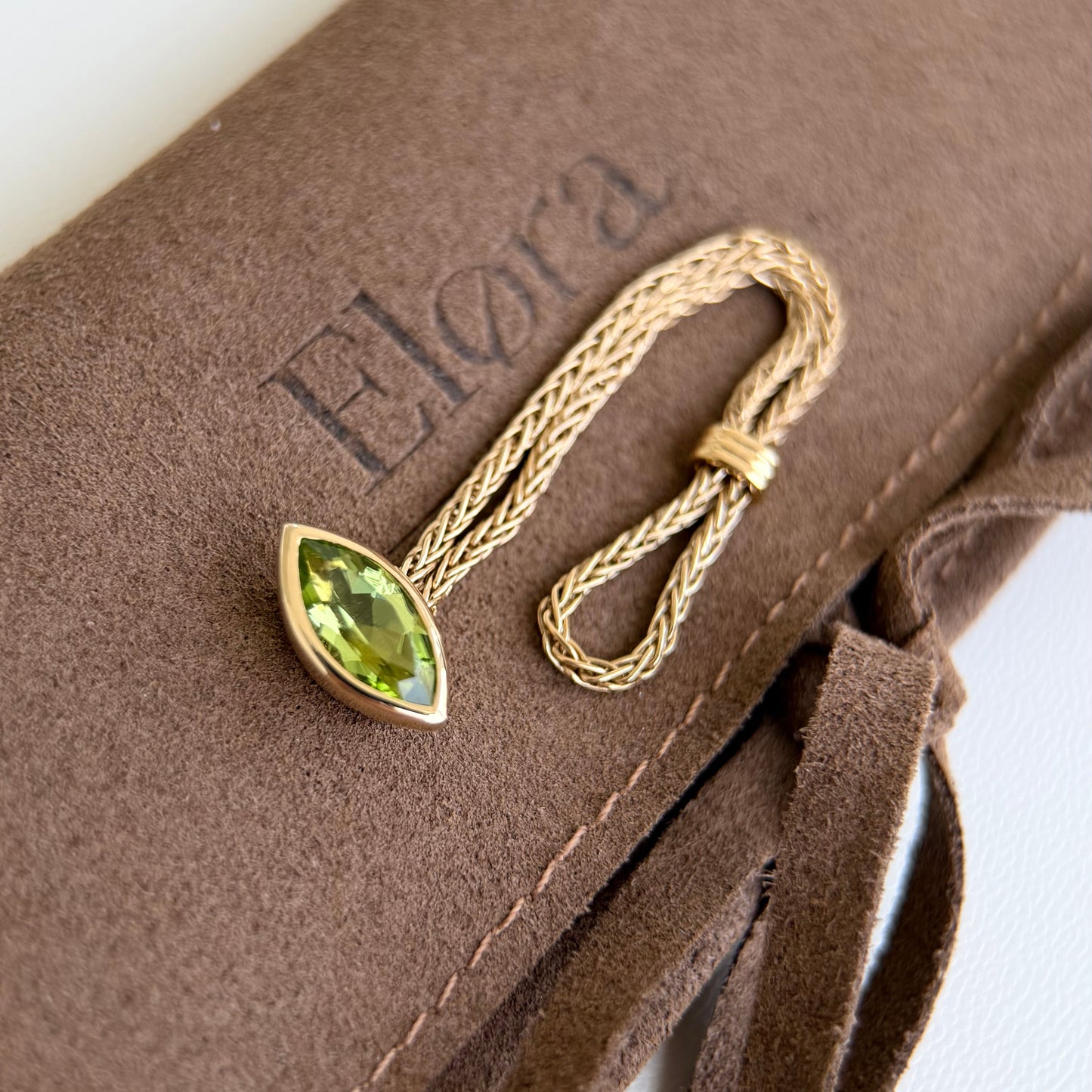 Faith-Marquise Cut Natural Peridot Gemstone Chain Ring with marquise cut peridot on a gold chain.